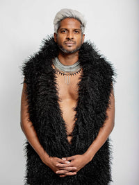 Black shaggy sleeveless fur jacket